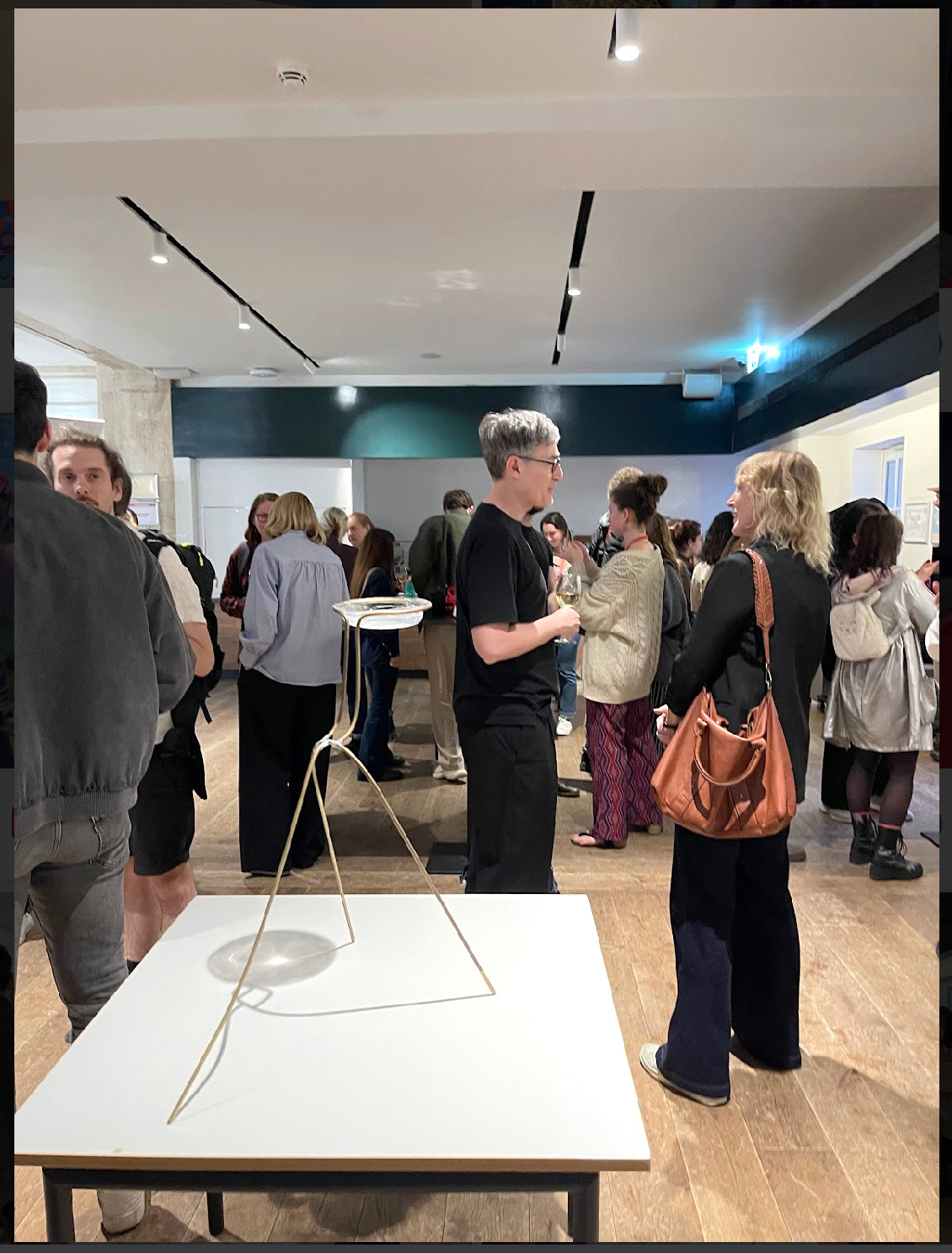 A photo of people looking at the exhibits displayed during IDL2024 event